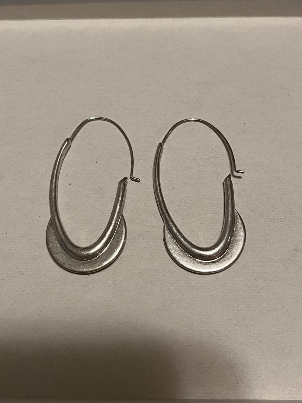 Silver tone hoop earrings